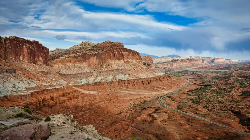 Highway winding through red rock canyon country north of Kanab, Utah — the long referral drive Kane County ACA plans in 84741 have to account for