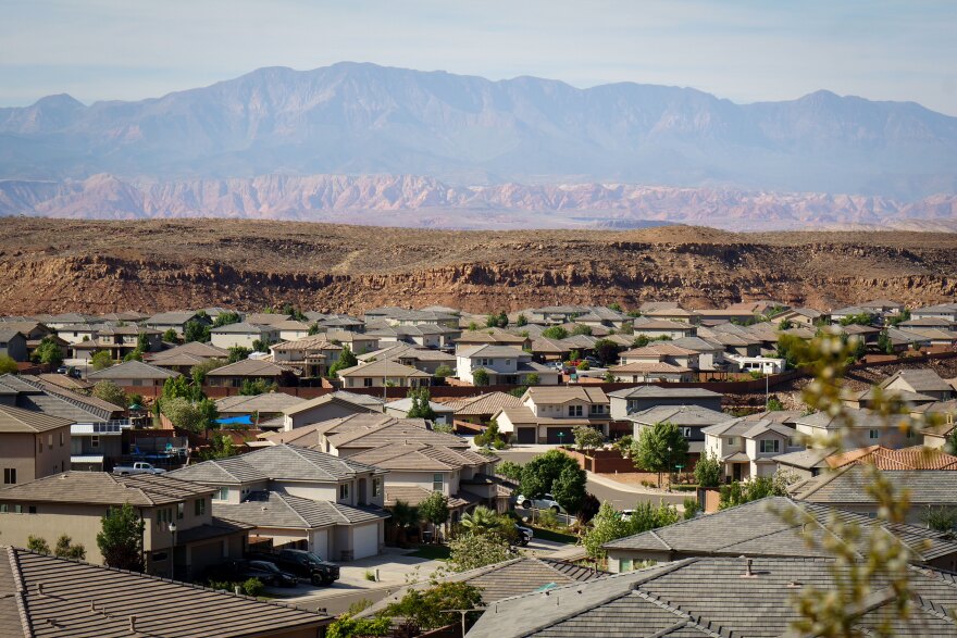 St. George, Utah neighborhood rooftops with Pine Valley Mountain in the distance — homeowners insurance for Little Valley, Desert Color, Sun River, and Stone Cliff