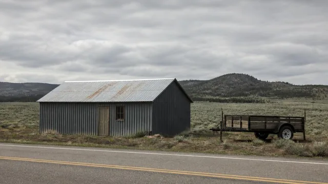 Rural outbuilding and utility trailer along the highway in Central, Utah — local commercial insurance risk factors for Central, Utah 84722 businesses