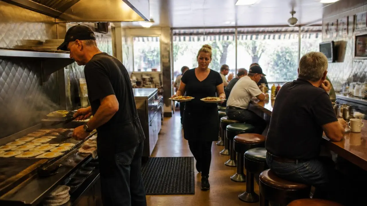 Small-town diner counter with locals eating breakfast in Hurricane, Utah — business insurance, BOP, general liability and workers' comp for Hurricane, Utah 84737 employers