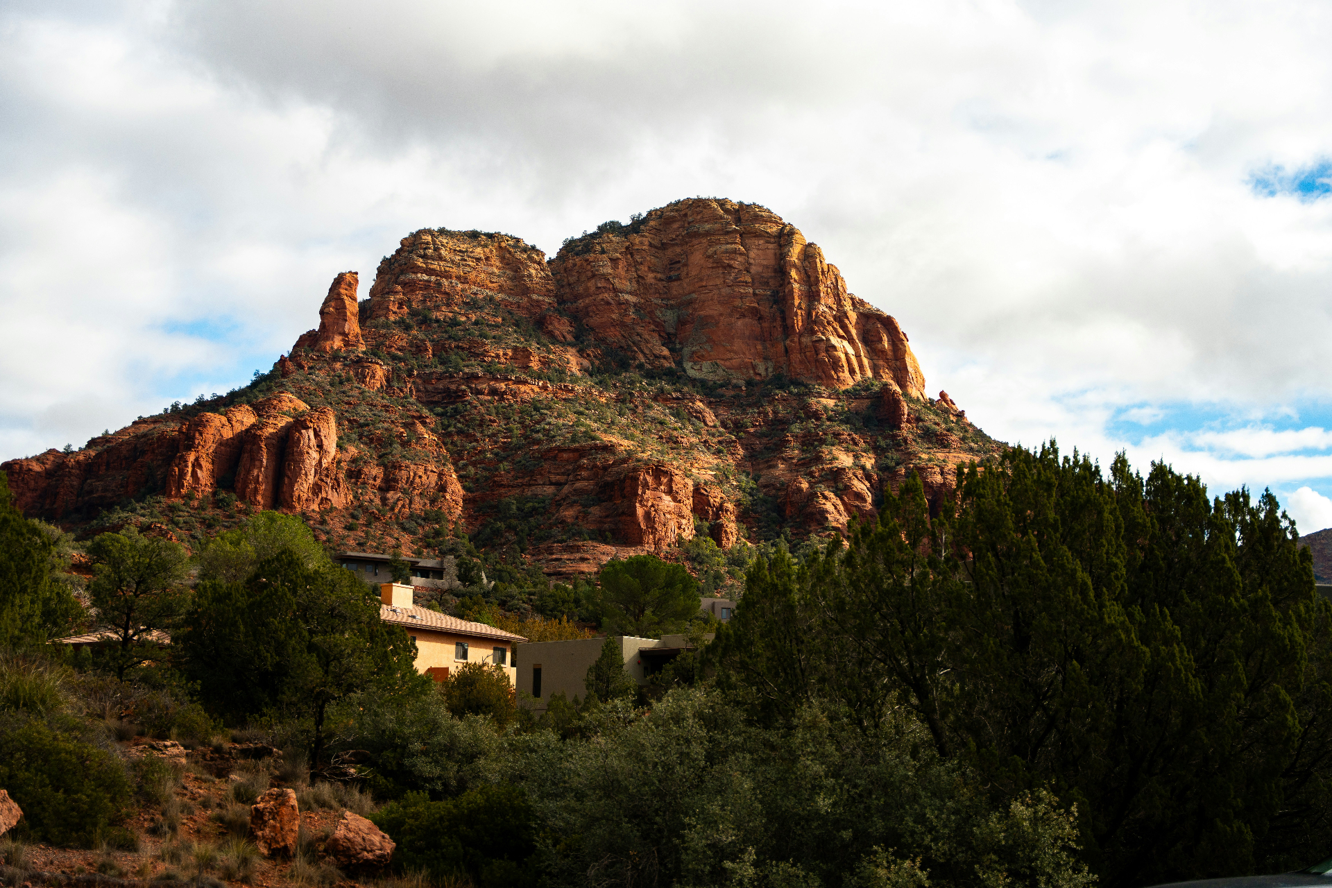 Cape-style cottage under mature shade trees — renters insurance in Kanab, UT