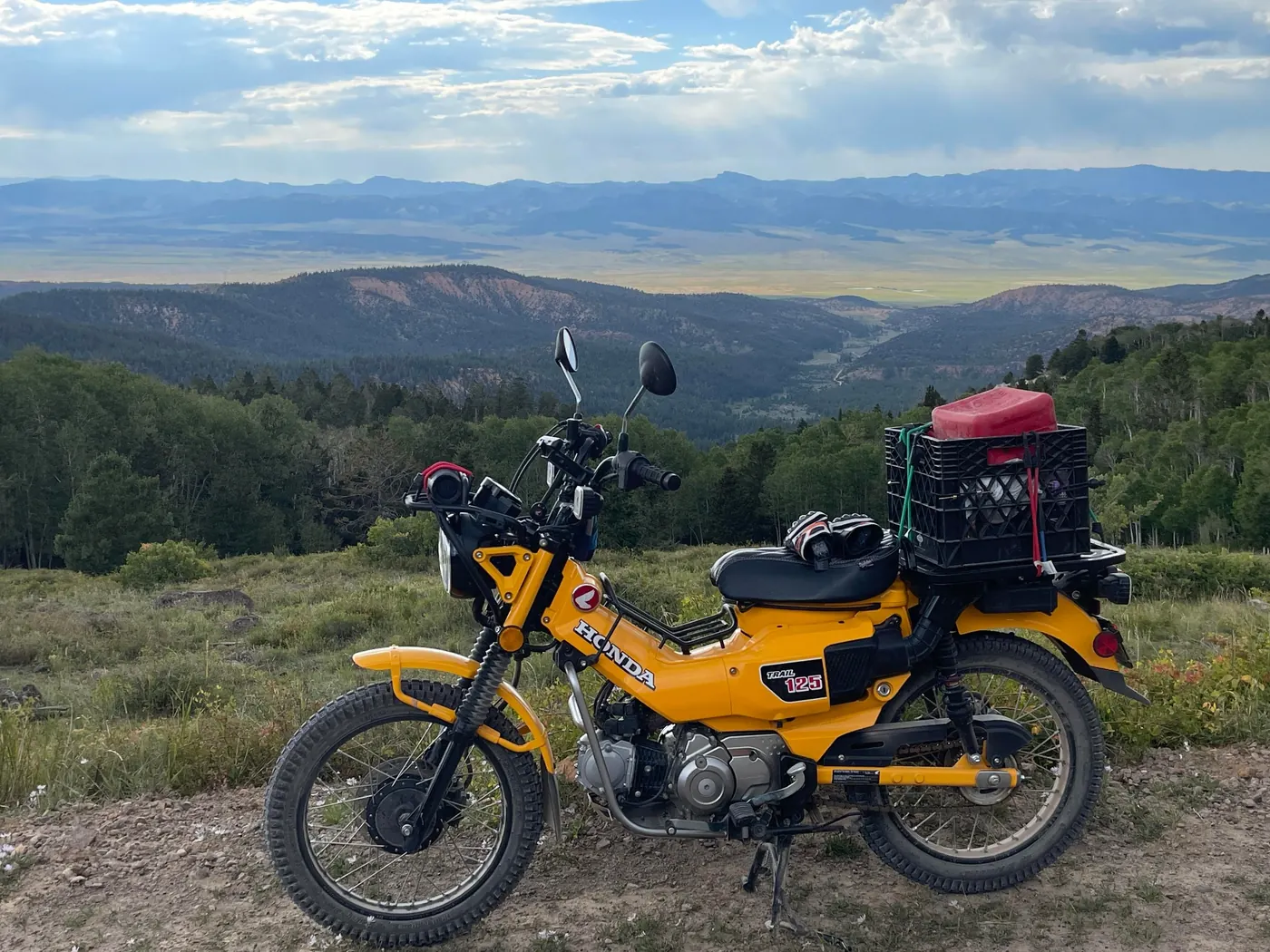 Honda Trail 125 loaded for adventure riding overlooking Cedar Breaks high-country