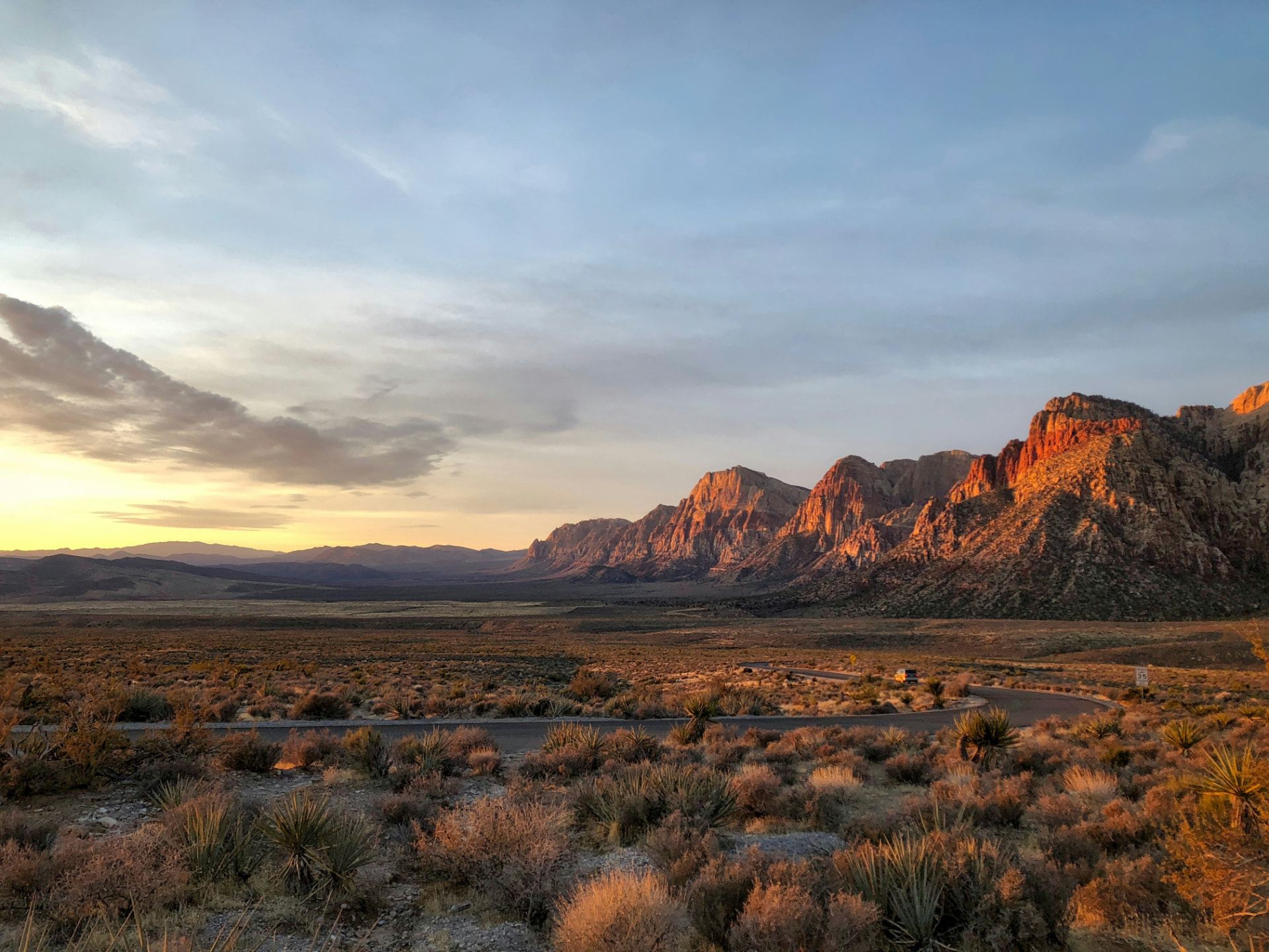 Sunrise over the red rock ridgeline and desert highway outside St. George, Utah — ACA / Obamacare health insurance enrollment for St. George households in 84770, 84771, 84790, and 84791