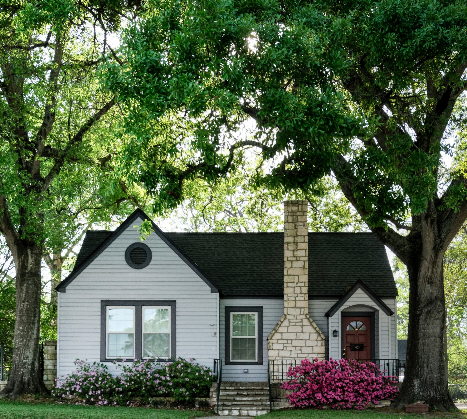 Cape-style cottage under mature shade trees — renters insurance in Kanab, UT