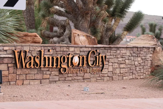 Washington City 'Where Dixie Begins' stone entrance sign with Joshua trees