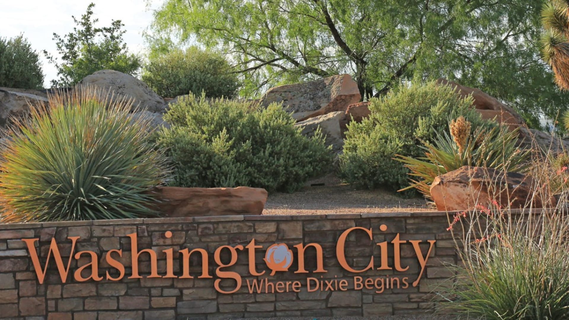 Washington City, Utah stone entrance monument surrounded by desert landscaping — auto insurance for Washington City drivers