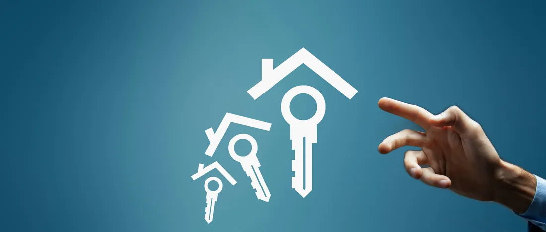 Hand reaching for house and key icons on a blue background