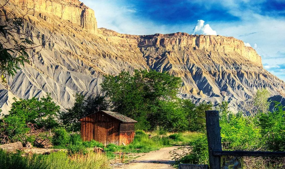 Rustic cabin beneath the cliffs of the Book Cliffs in Southern Utah