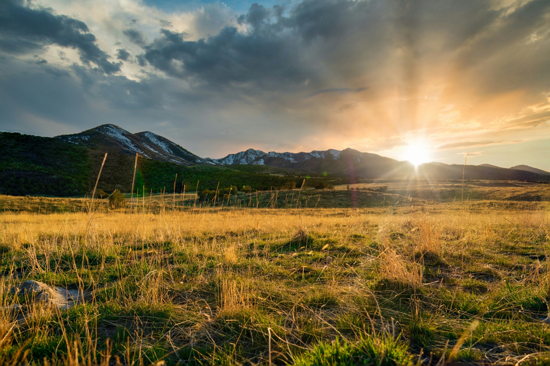 Sunset over the Pine Valley Mountains and open Hurricane Valley grasslands near La Verkin, Utah — the wildland edge and monsoon exposure that shape 84745 home insurance