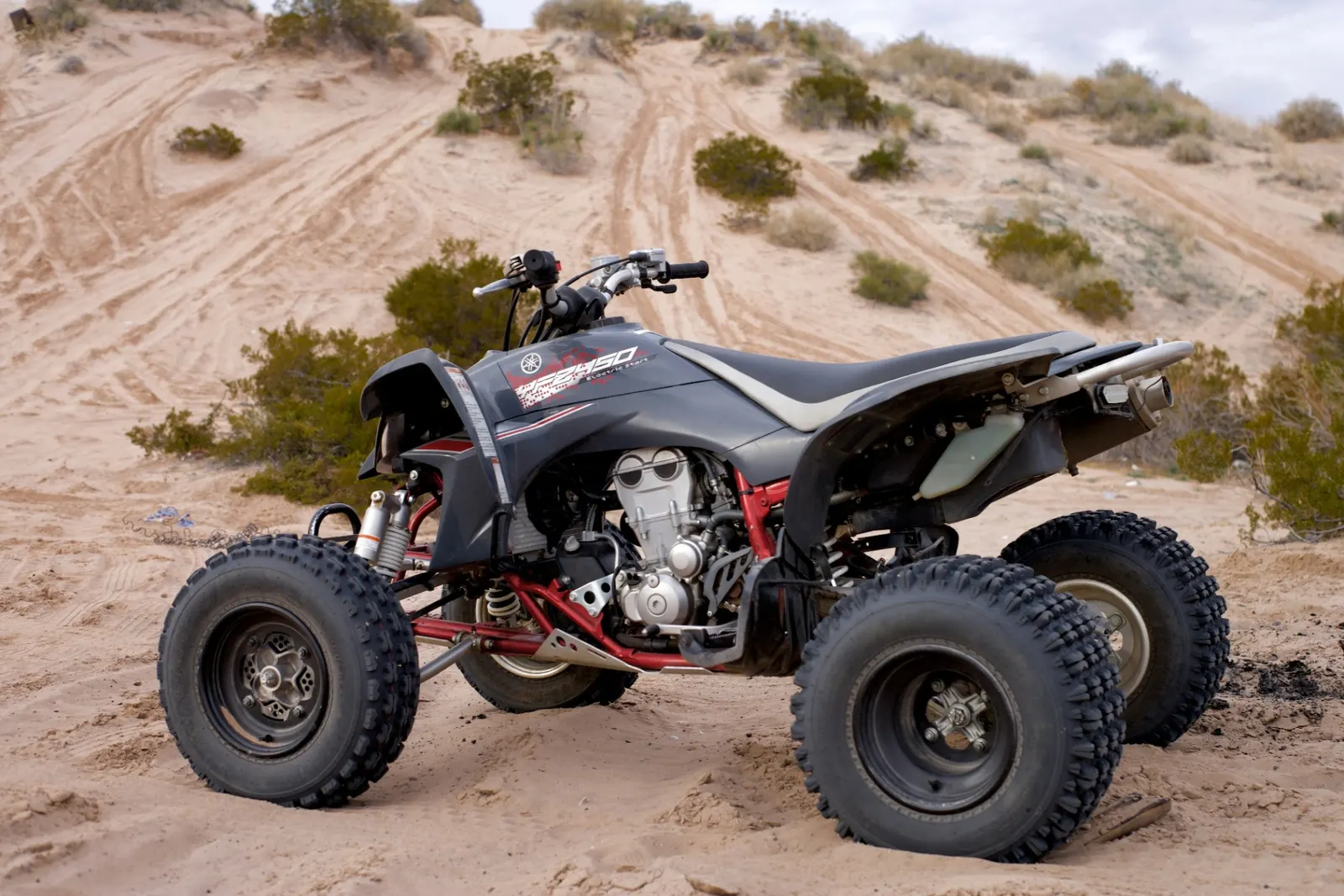 Sport ATV parked in Southern Utah desert sand