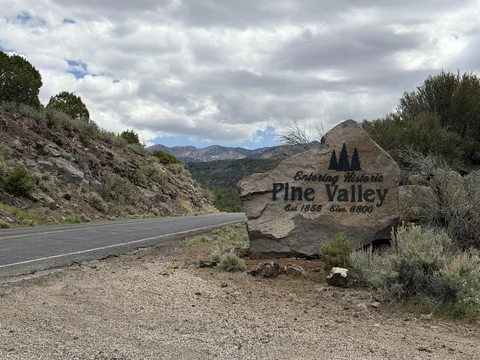 Entering Historic Pine Valley, Utah entrance sign on Highway 18 with mountain valley backdrop — auto insurance for Pine Valley, UT 84781 drivers