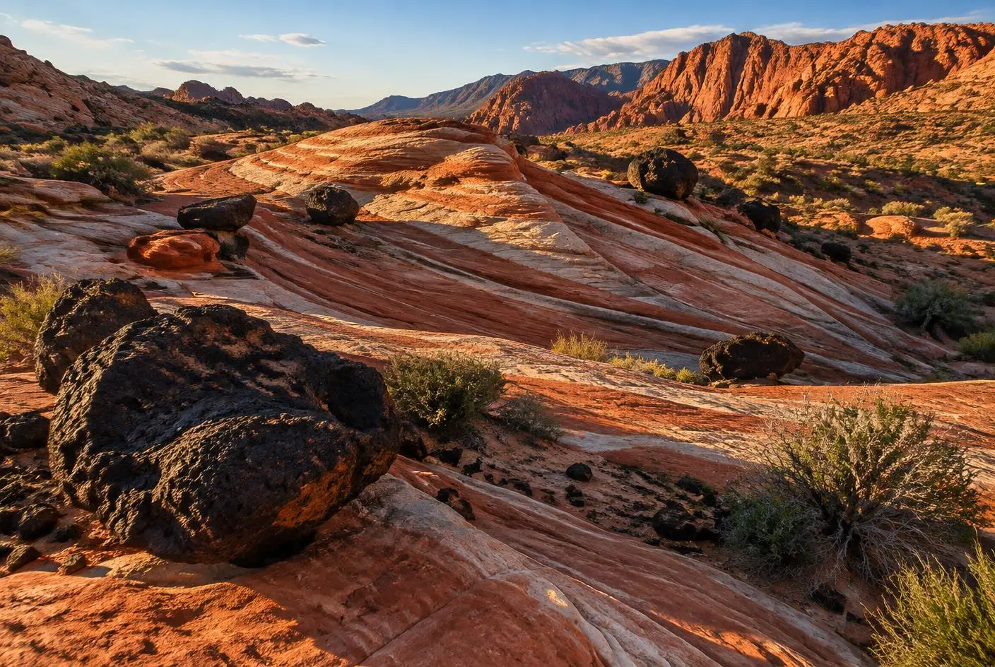 Red and white sandstone dunes and black lava rock in Snow Canyon near St. George