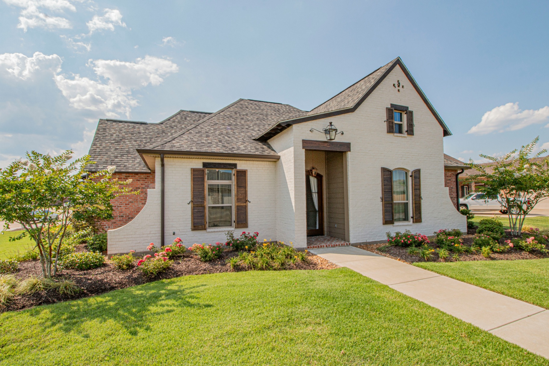 White brick single-family rental home with covered entry — Toquerville, UT area
