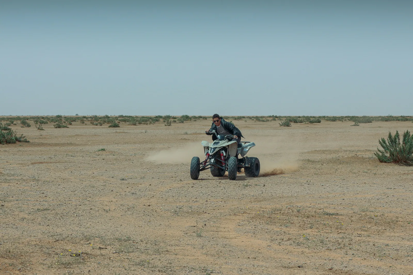 Sport quad rider on open desert near Hurricane, Utah