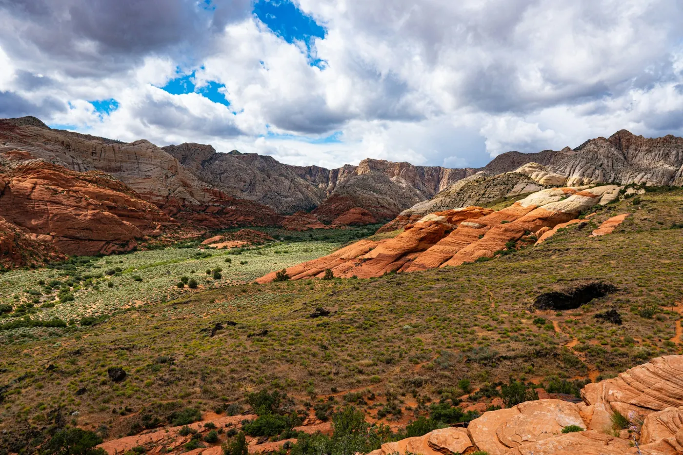 Red sandstone cliffs and desert valley on the wildland edge of Ivins, Utah (84738) — the wildland-urban interface that shapes homeowners insurance rebuild costs