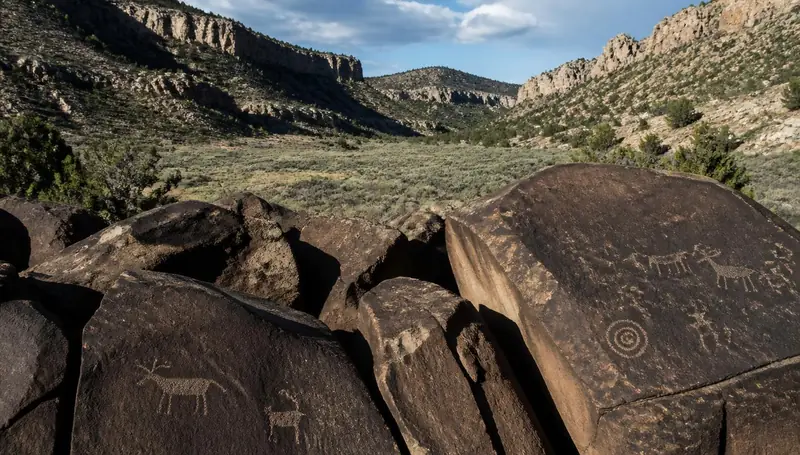 Petroglyph boulders in the rocky notch of Parowan Gap, Utah — health insurance and ACA Marketplace enrollment for Parowan, Utah 84761 households