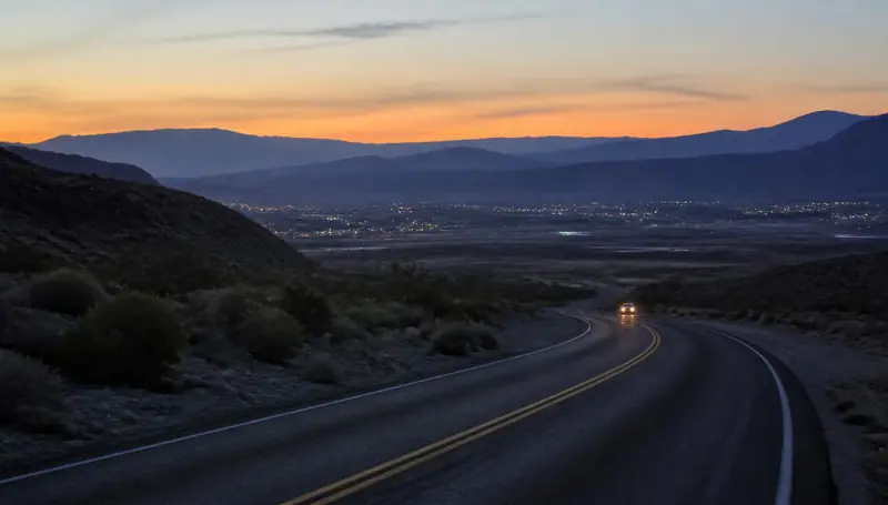 SR-18 highway at dusk crossing the black lava country outside Veyo, Utah — health insurance and ACA Marketplace enrollment for Veyo, Utah 84782 households