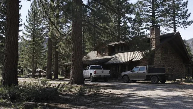 Mountain lodge and work trucks under tall pines in Pine Valley, Utah — local commercial insurance risk factors for Pine Valley, Utah 84781 businesses