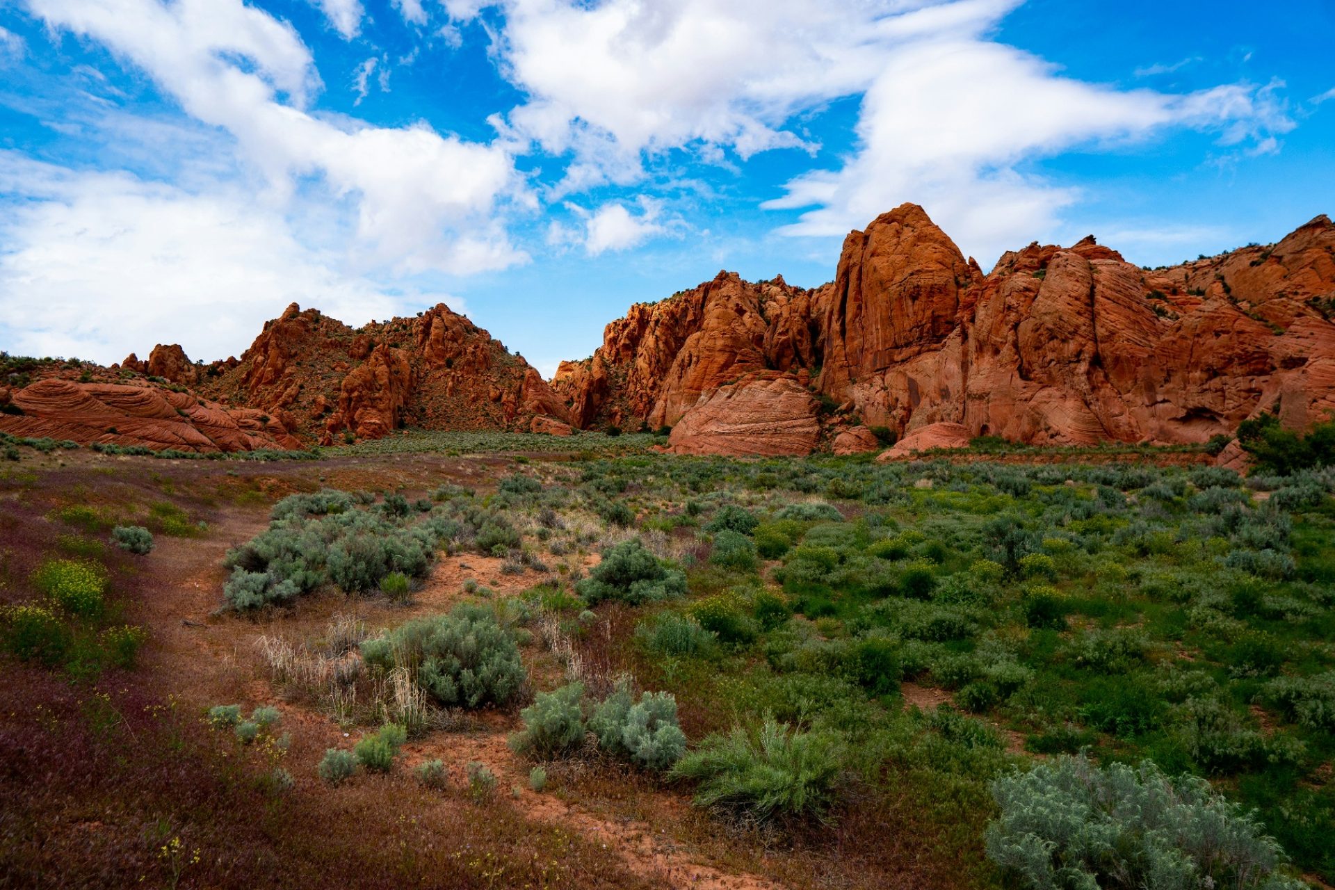 Homeowners insurance Santa Clara, Utah (84765) — Snow Canyon red sandstone cliffs and sagebrush flats on the western edge of Santa Clara, where wildland-urban interface and Santa Clara River flood exposure shape home rebuild costs