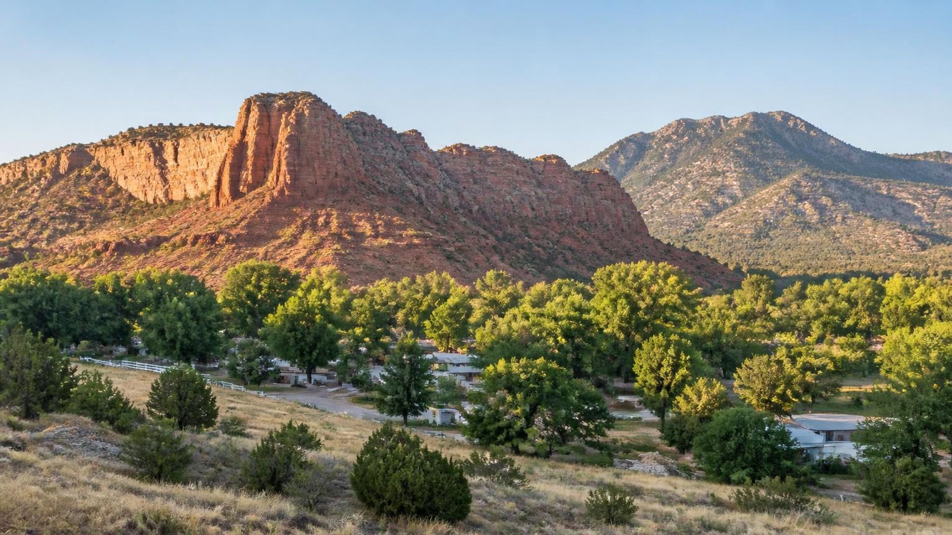 Cottonwood-shaded homes below the red Silver Reef ridge in Leeds, Utah (ZIP 84746) — ACA / Obamacare Marketplace health insurance, subsidies and off-Marketplace plans for Leeds, Utah households