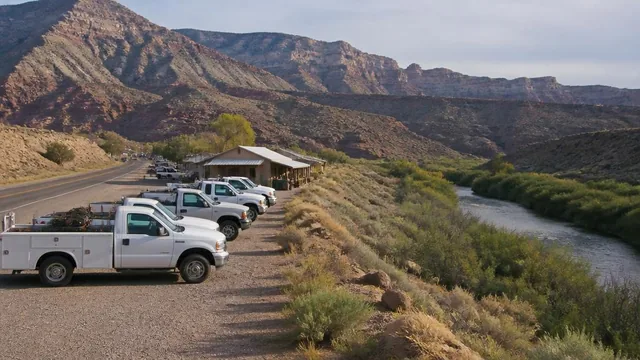 Highway-frontage shops and work trucks on the bench above the Virgin River in La Verkin, Utah — local commercial insurance risk factors for La Verkin, Utah 84745 businesses