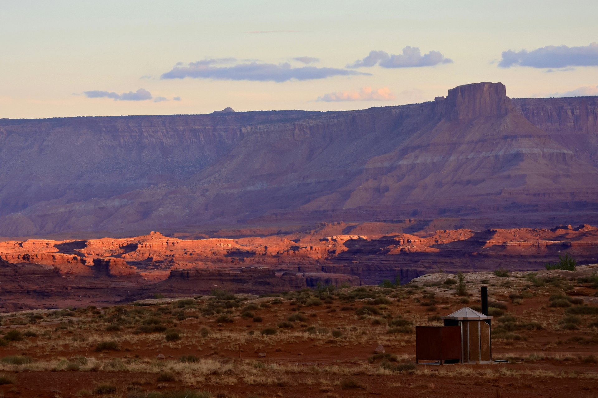 Homeowners insurance Hurricane, Utah — Hurricane Cliffs and Pine Valley mesa rising above the 84737 valley with red sandstone bluffs at sunset near Sand Hollow and the Virgin River corridor