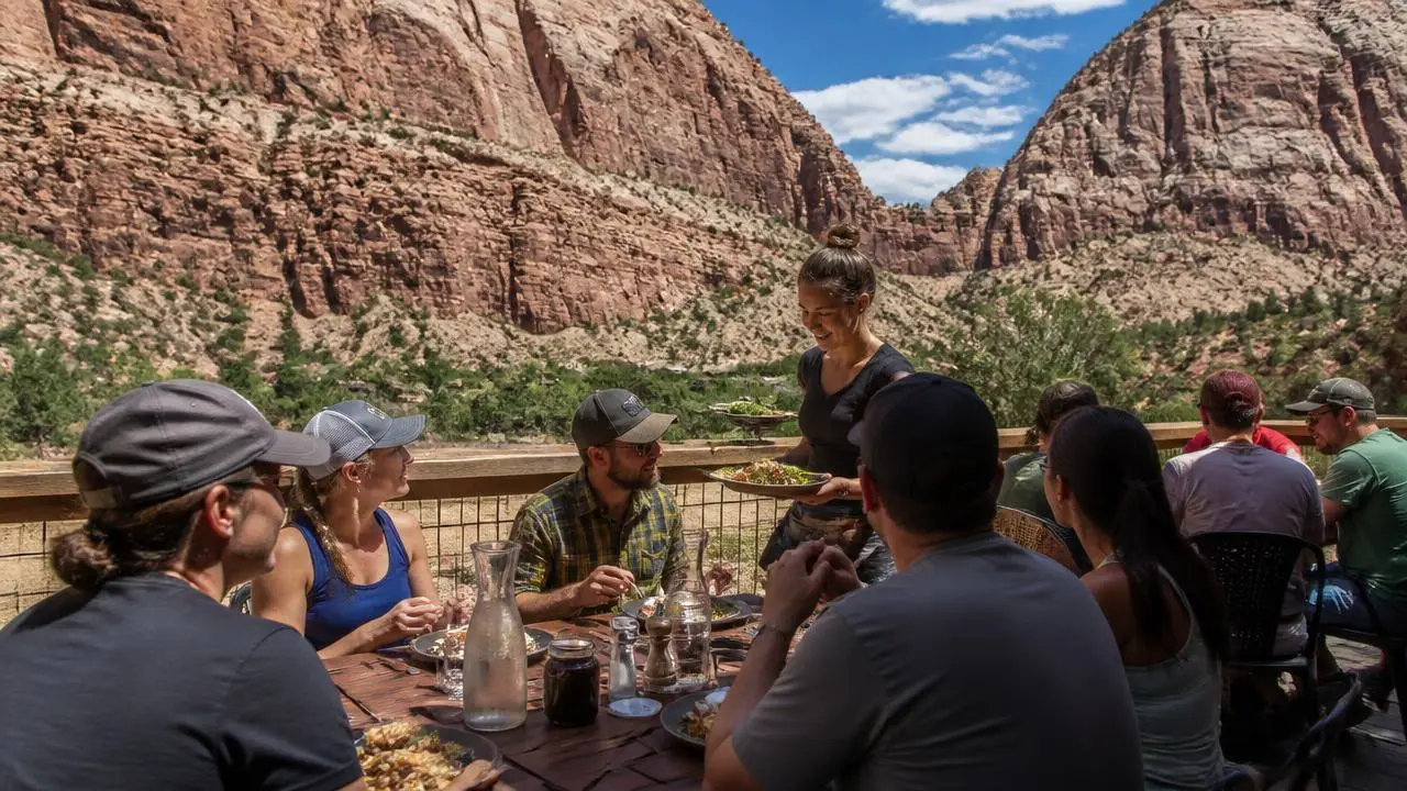Restaurant patio with diners under canyon walls in Springdale, Utah — business insurance, BOP, general liability and workers' comp for Springdale, Utah 84767 employers