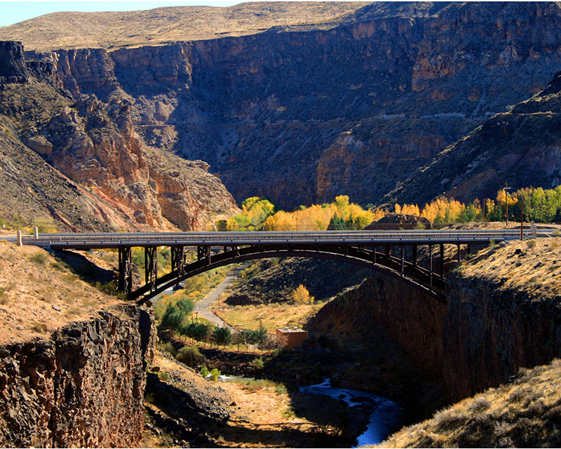 The Highway 9 arch bridge spanning the Virgin River canyon between La Verkin and Hurricane, Utah — the SR-9 grade and canyon corridor that shape La Verkin auto rates