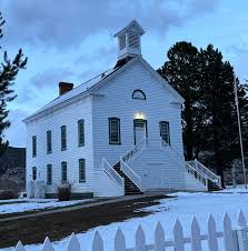 Historic Pine Valley Chapel at dusk with snow on the ground — Pine Valley, UT auto insurance