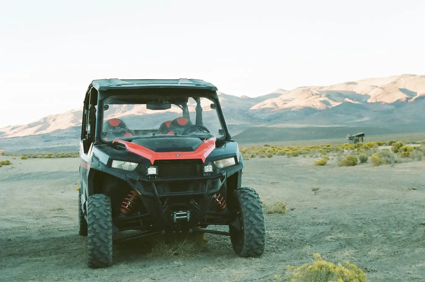 Polaris General side-by-side parked in Southern Utah desert at sunset — UTV insurance Utah