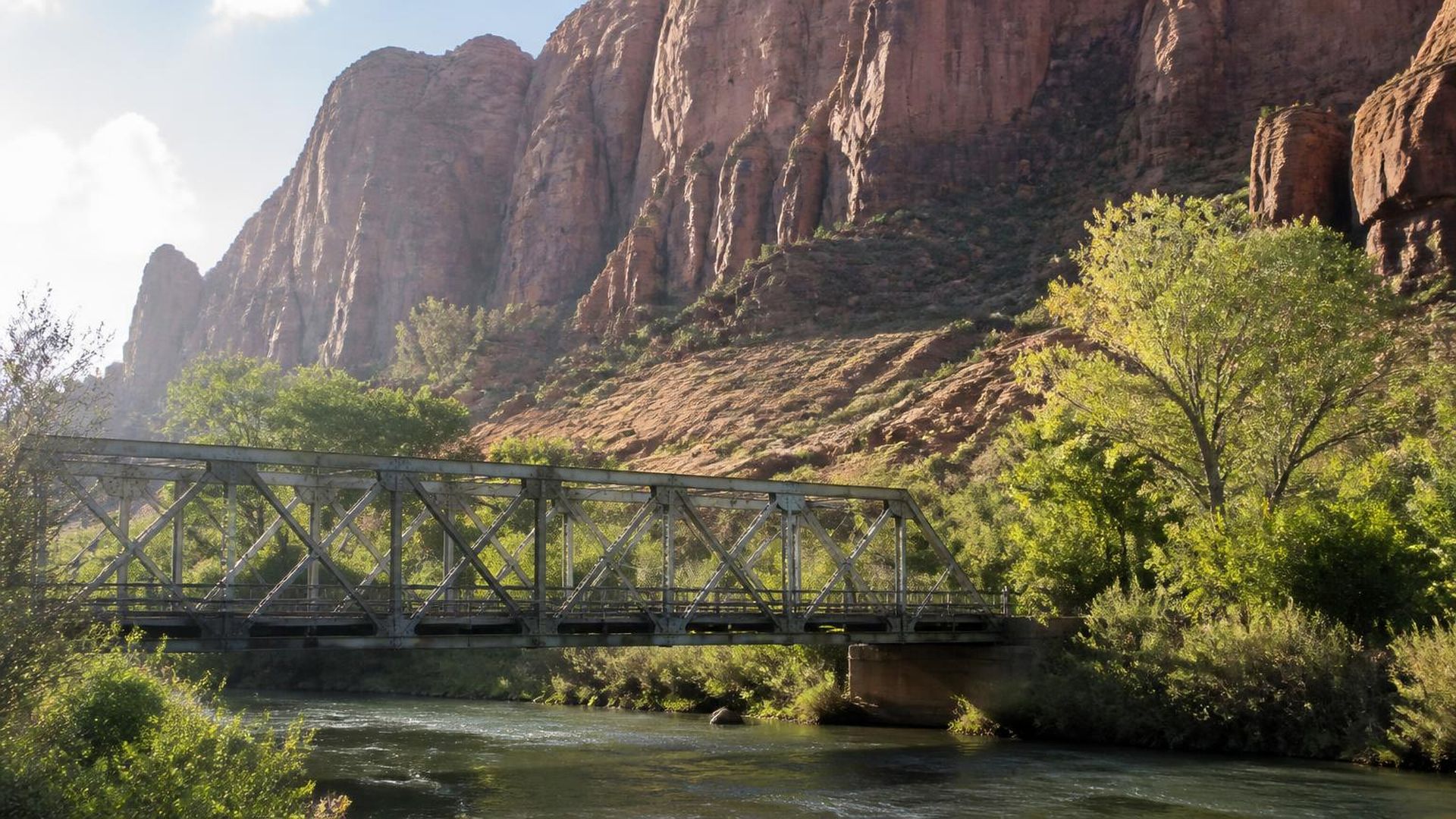 The historic steel truss bridge over the Virgin River beneath red cliffs at Rockville, Utah (ZIP 84763) — ACA / Obamacare Marketplace health insurance, subsidies and off-Marketplace plans for Rockville, Utah households