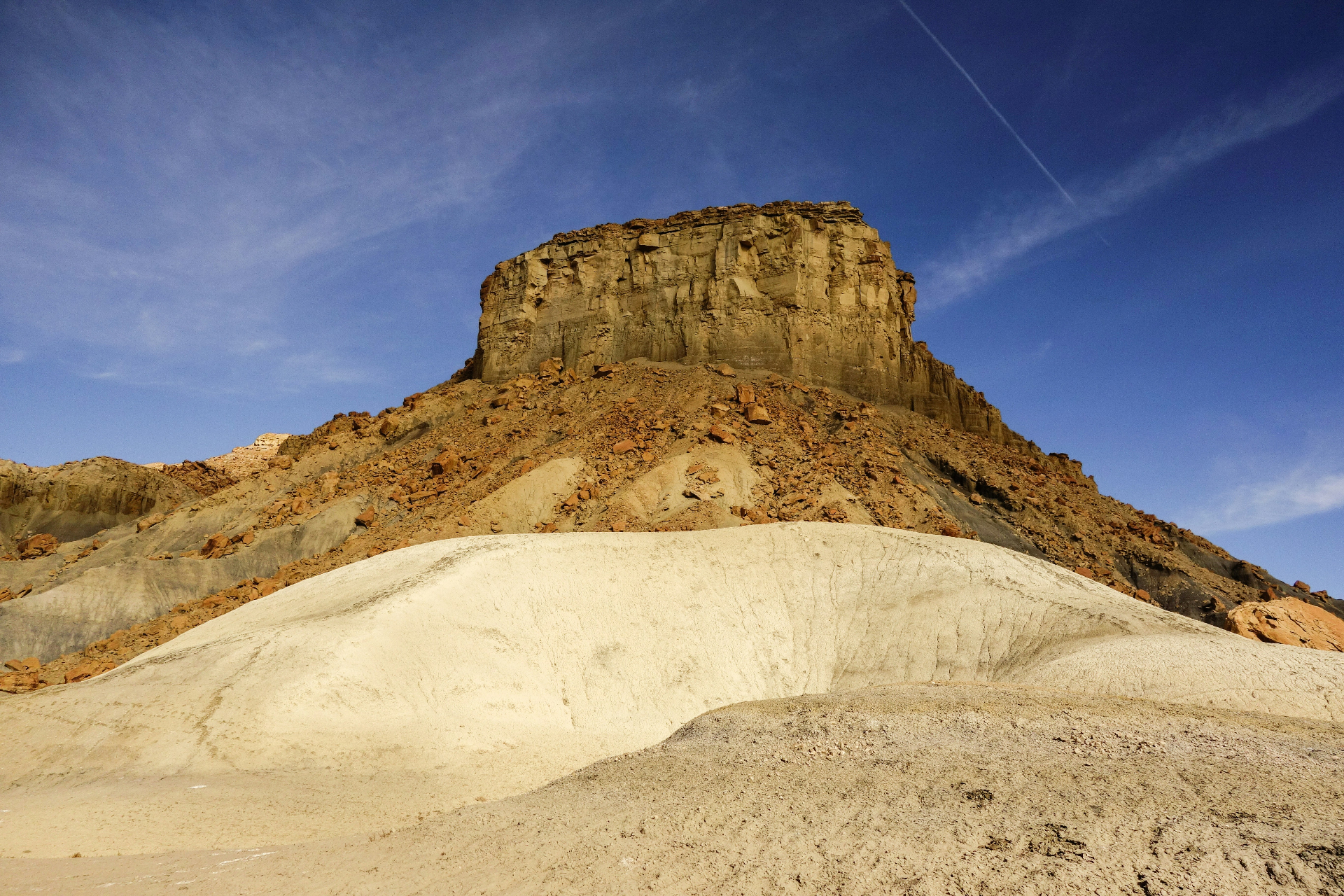Towering sandstone butte rising above the Kanab, Utah badlands — the remote Kane County terrain and wildland-urban interface that carriers rate into every 84741 homeowners insurance quote