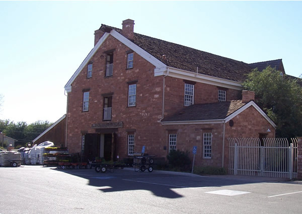 The historic Washington Cotton Mill — a red sandstone landmark in Washington City, Utah and reminder that older 84780 homes need rebuild costs re-quoted to current replacement value