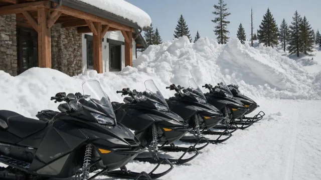 Snowmobiles lined up in deep snow outside a mountain rental building in Brian Head, Utah — local commercial insurance risk factors for Brian Head, Utah 84719 businesses