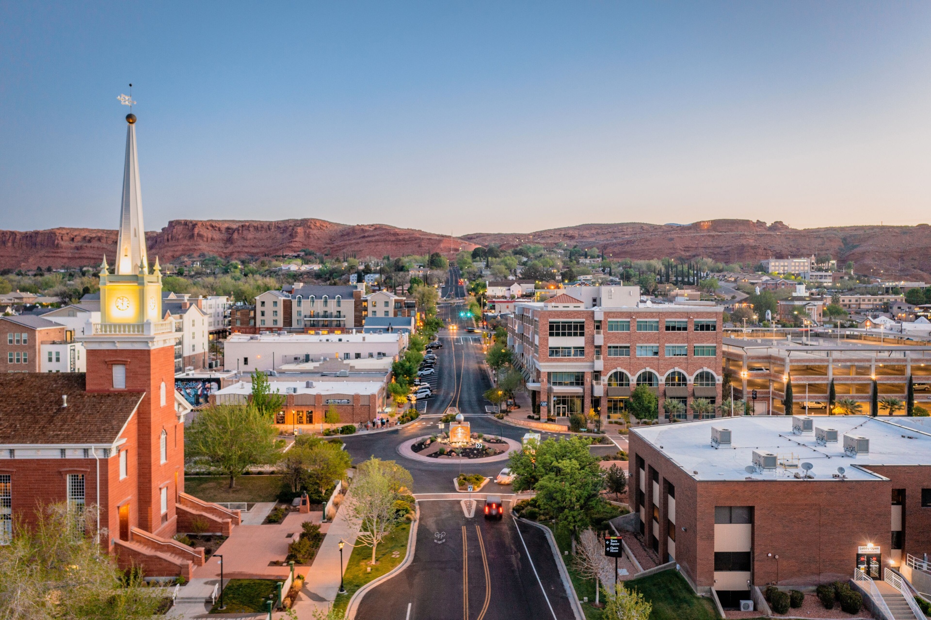 St. George, Utah downtown at dusk with red rock cliffs — serving renters across Southern Utah