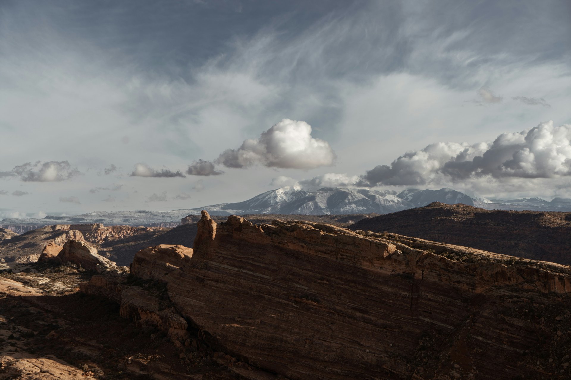 Red rock canyon country near Hurricane, Utah with snow-capped mountains — renters insurance in Hurricane, UT