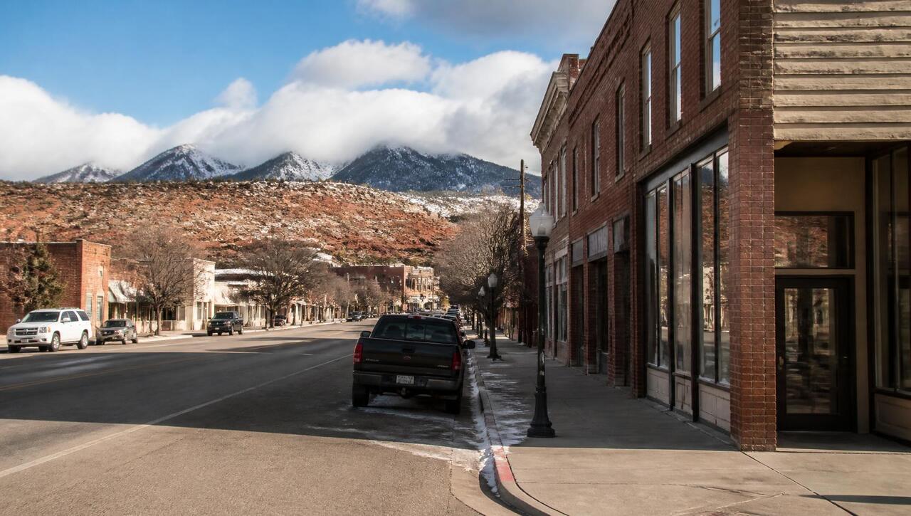 Historic brick storefronts along the wide main street of Parowan, Utah in winter (ZIP 84761) — business insurance, BOP, general liability, commercial property and workers' comp for Parowan, Utah employers
