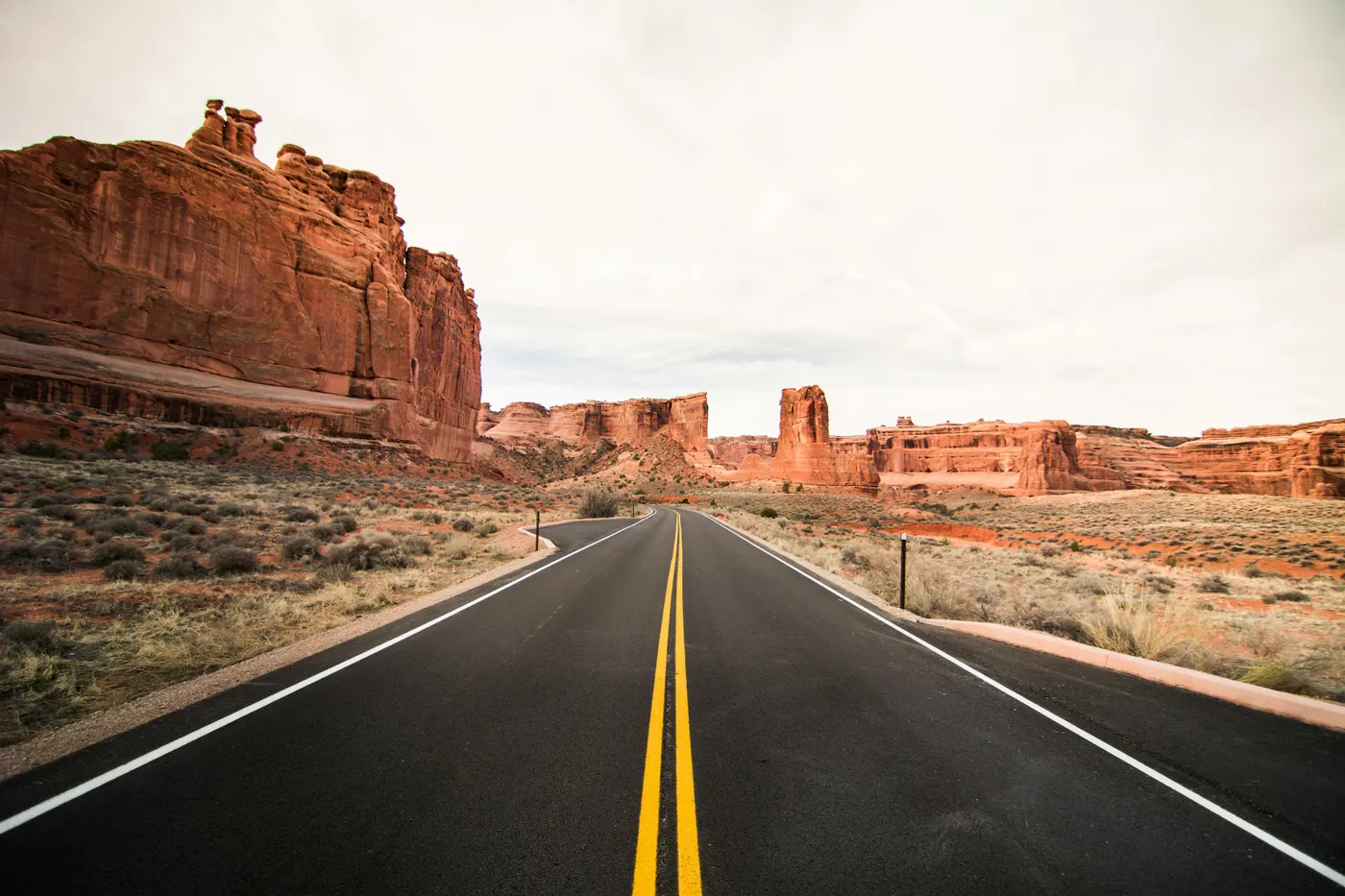 Open Southern Utah highway through red rock country — ACA health insurance for Utah travelers and residents
