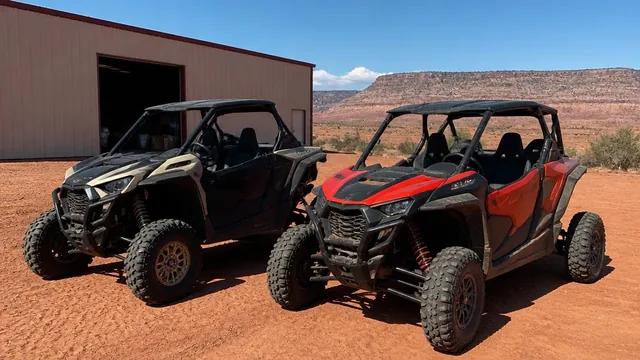 UTVs staged on red sand outside a metal shop building in Apple Valley, Utah — local commercial insurance risk factors for Apple Valley, Utah 84737 businesses