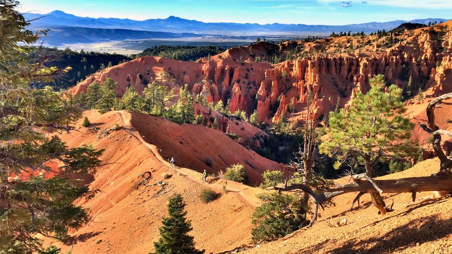 Hikers on a red rock ridgeline at Thunder Mountain near Bryce Canyon, Southern Utah