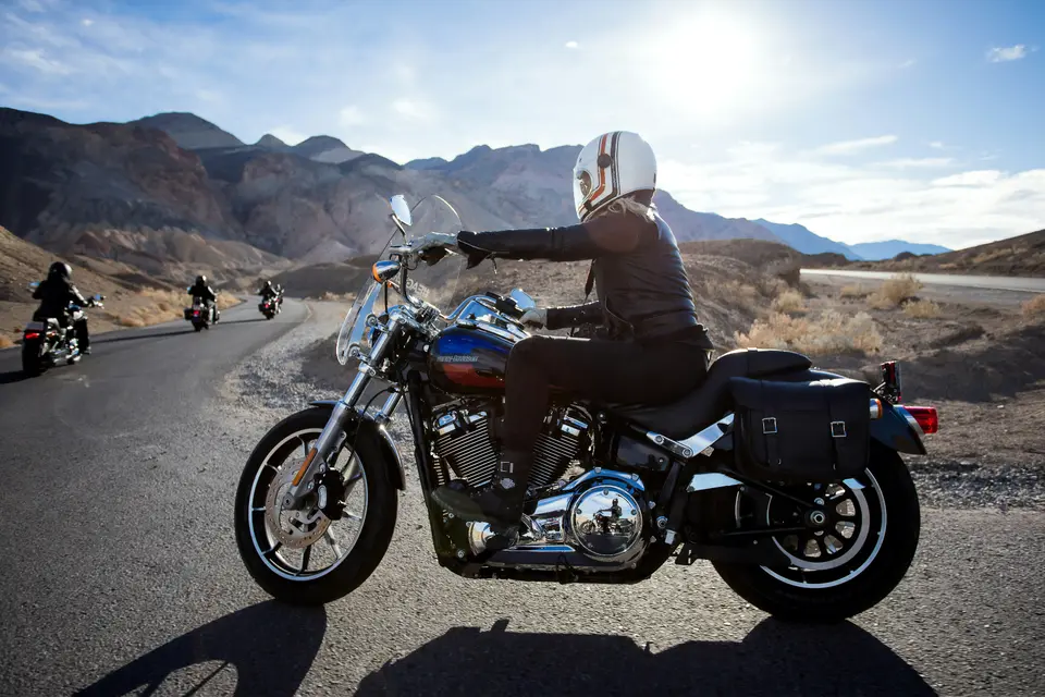 Cruiser rider on a Southern Utah canyon road at sunset — the kind of ride OnPoint motorcycle insurance is built for.