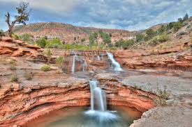 Toquerville Falls cascading over red sandstone in Ash Creek Canyon, Toquerville UT