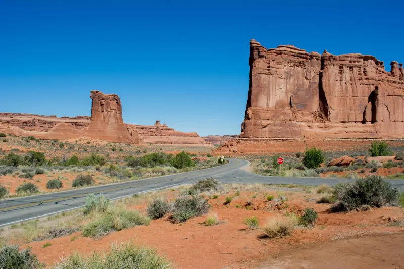 Red rock towers along a Southern Utah desert highway — local Utah health insurance agency