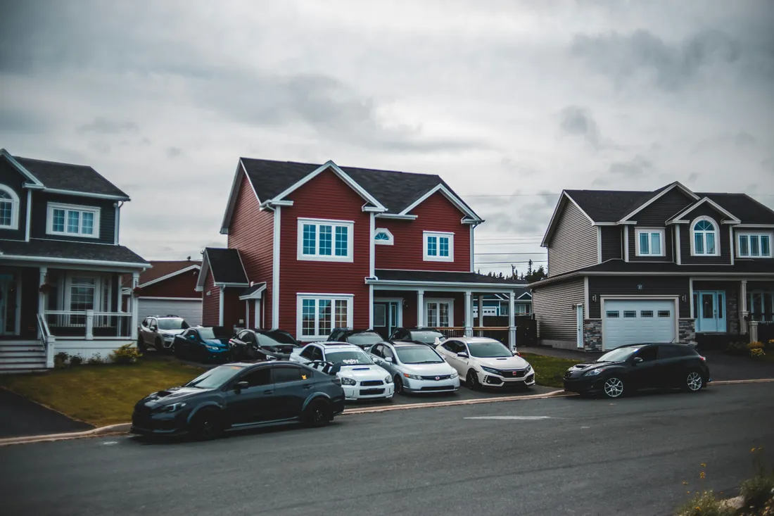 Cars parked in front of rental homes in a residential neighborhood