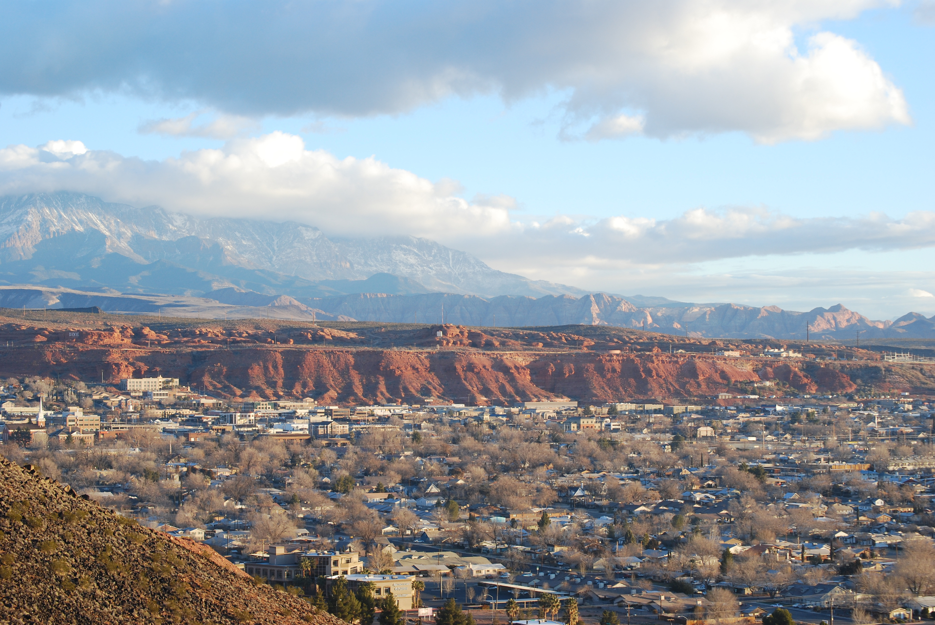 St. George, Utah skyline with Pine Valley Mountains and red rock bluffs in the background