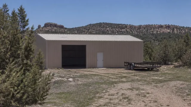 Detached shop building and equipment trailer on an acreage property in Dammeron Valley, Utah — local commercial insurance risk factors for Dammeron Valley, Utah 84783 businesses