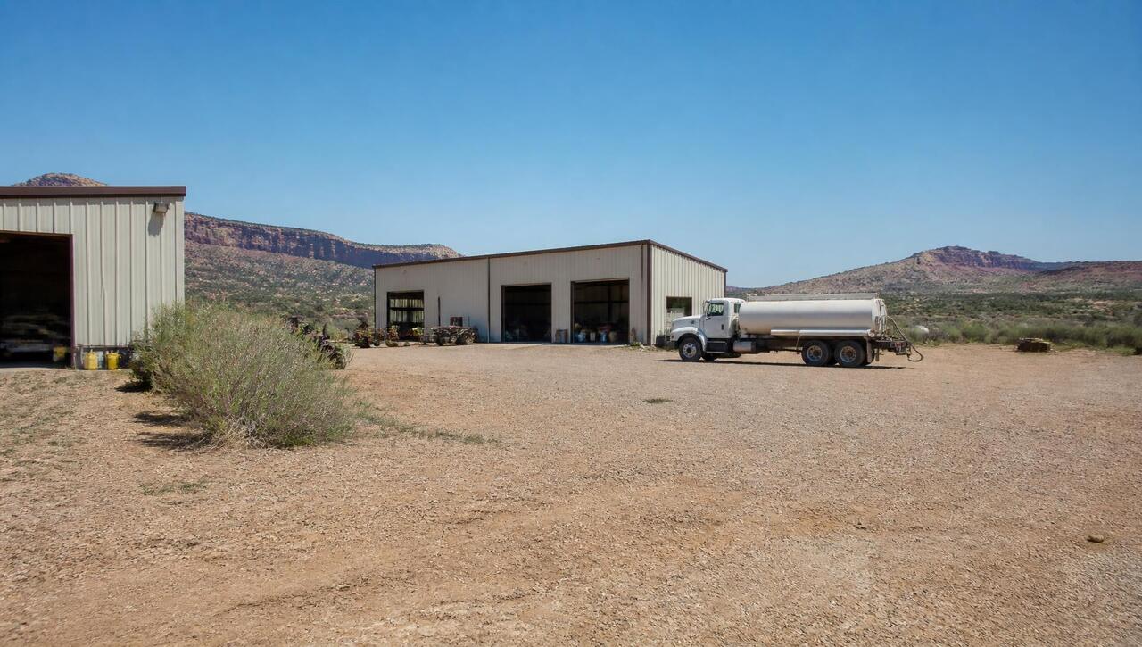 Metal shop building and gravel yard with a water truck in Apple Valley, Utah (ZIP 84737) — business insurance, BOP, general liability, commercial property and workers' comp for Apple Valley, Utah employers