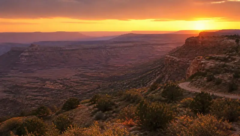 Sunset over the Gooseberry Mesa backcountry road in southern Utah — health insurance and ACA Marketplace enrollment for Apple Valley, Utah 84737 households