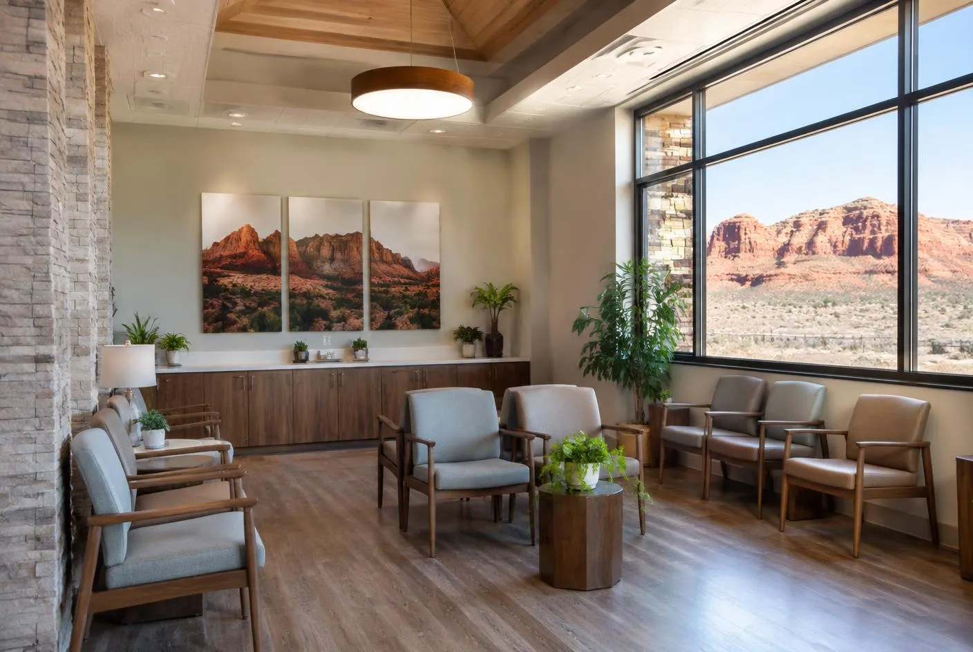 Empty clinic waiting room with large windows facing red rock mesas in Southern Utah