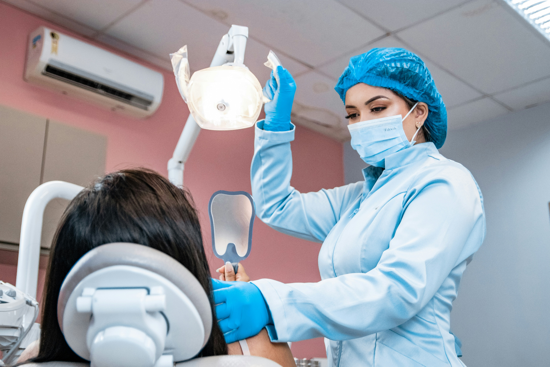 Dentist examining a patient — dental insurance coverage from OnPoint Insurance Group in St. George, Utah